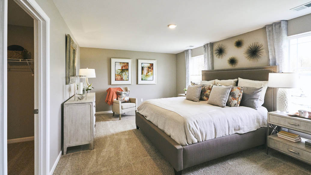 The impressive owner’s suite boasts an expansive bedroom with a huge walk-in closet.