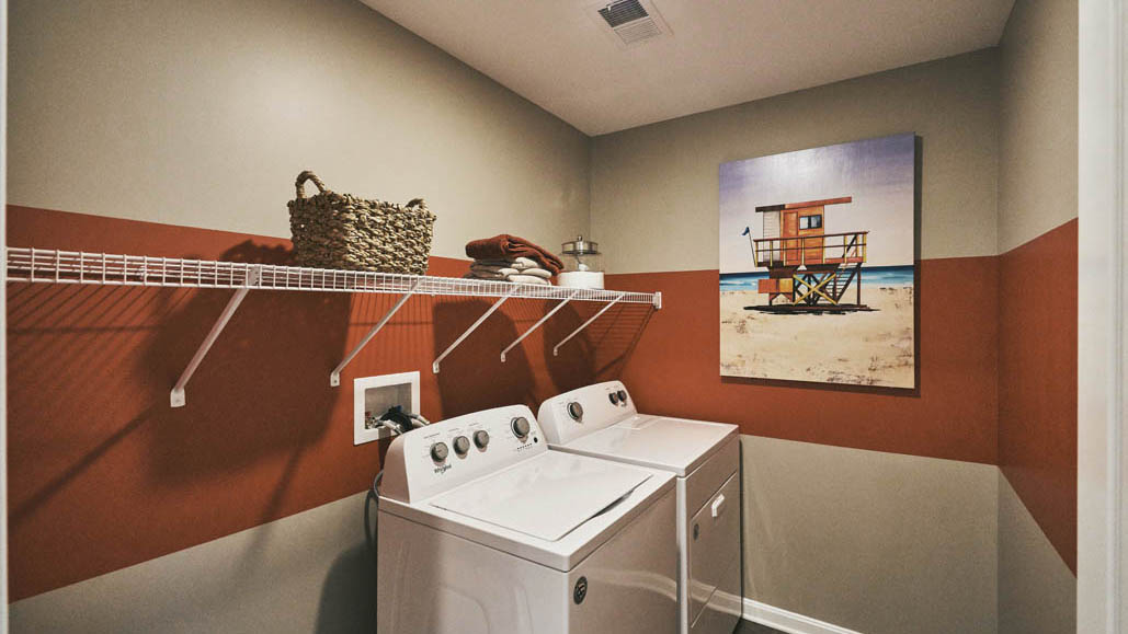 The conveniently located laundry room with an included washer and dryer complete the upstairs.