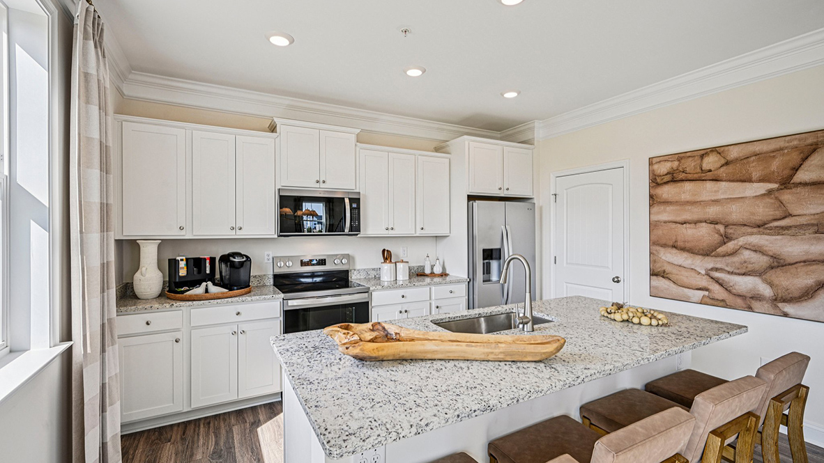The well-designed gourmet kitchen features an oversized corner pantry.