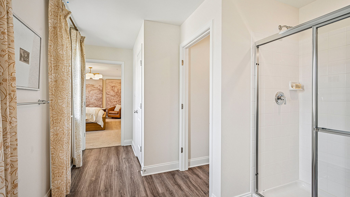 The impressive owner’s suite boasts an expansive bedroom and a contemporary owner’s bathroom with a large shower.