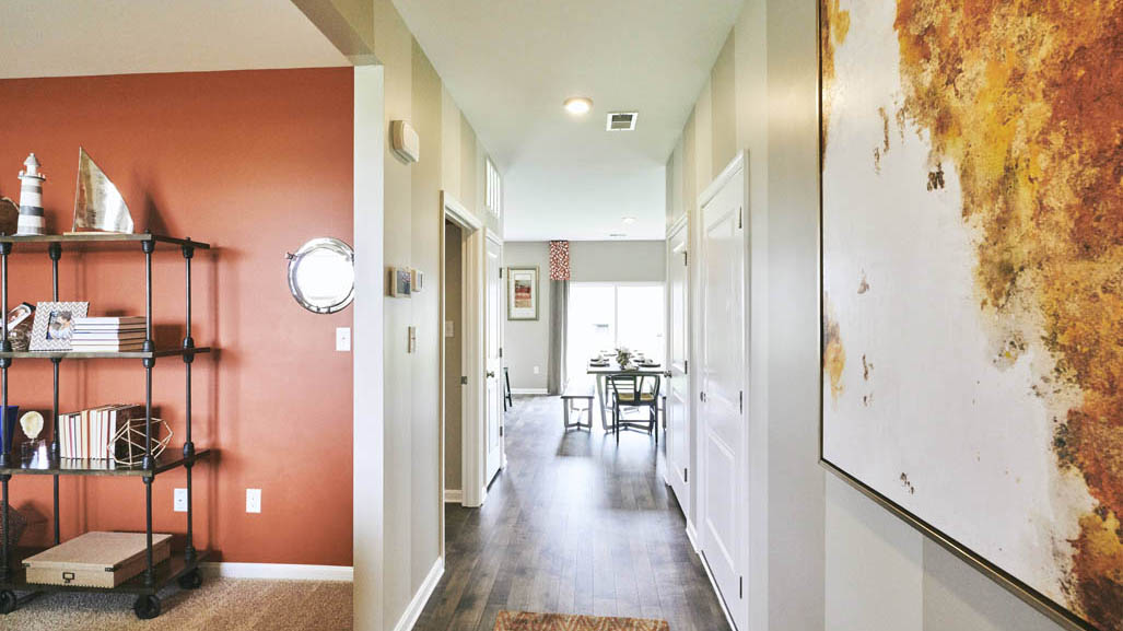 This well-designed home has an inviting foyer that is open to the functional flex room.