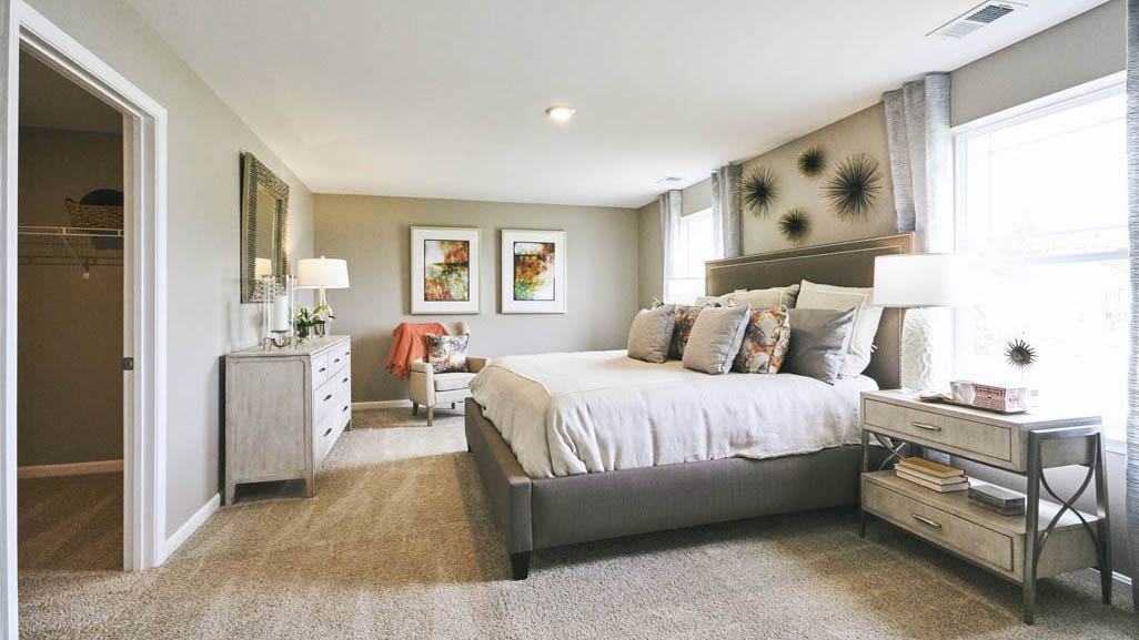 The impressive owner’s suite boasts an expansive bedroom with a huge walk-in closet.