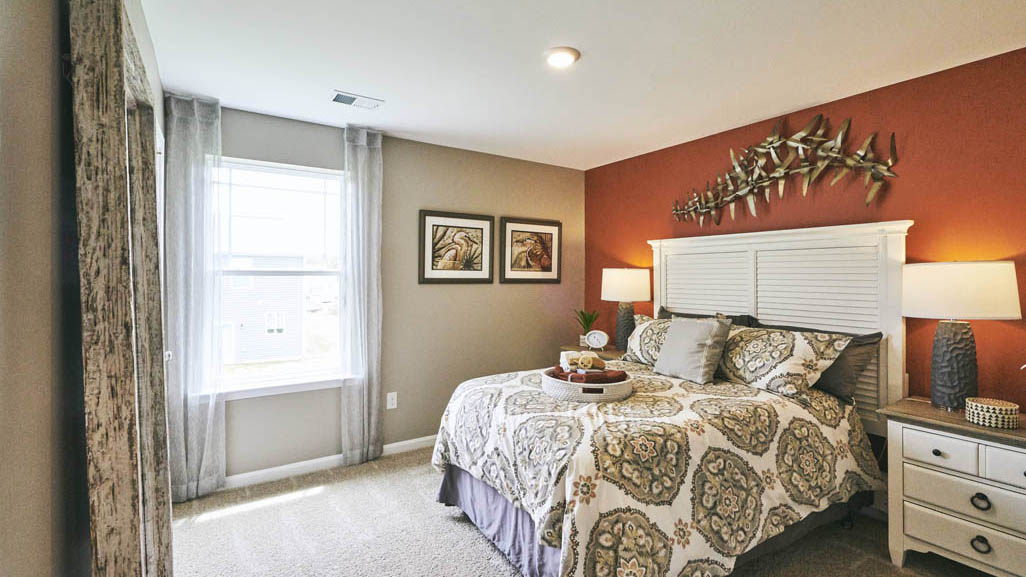 Three generously sized secondary bedrooms, and a spacious hall bathroom with double vanity complete the upstairs.