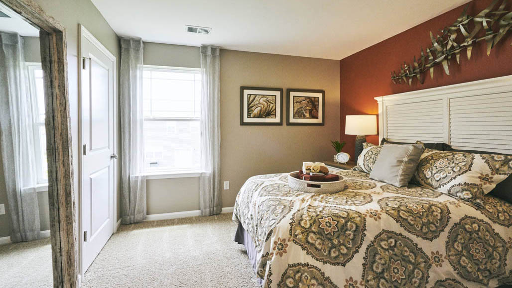 Three generously sized secondary bedrooms, and a spacious hall bathroom with double vanity complete the upstairs.