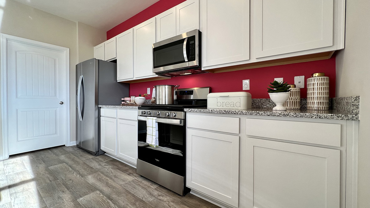 The well-designed kitchen features modern cabinetry.
