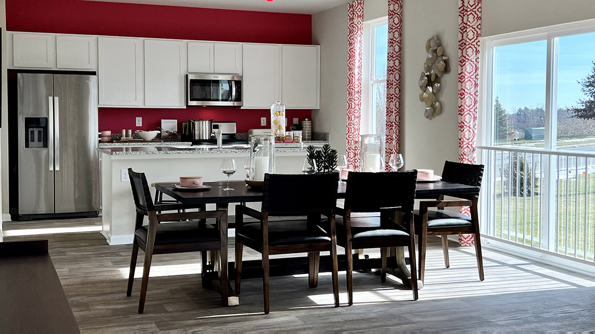 The well-designed gourmet kitchen features stainless steel appliances.