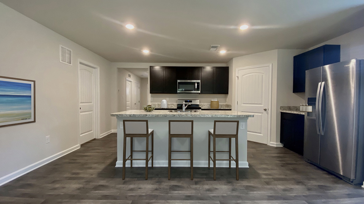 There is a large center island in the kitchen.
