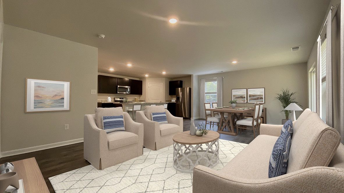 The ample great room and dining area both offer an abundance of natural light.
