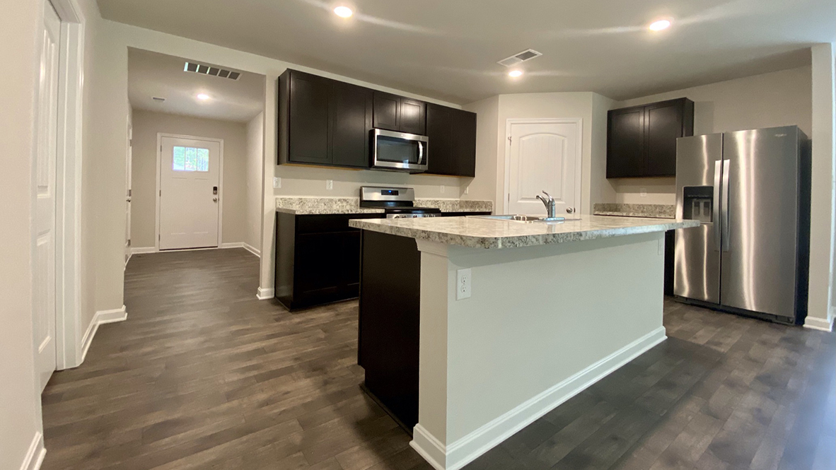 The home's well-designed kitchen features a large center island.