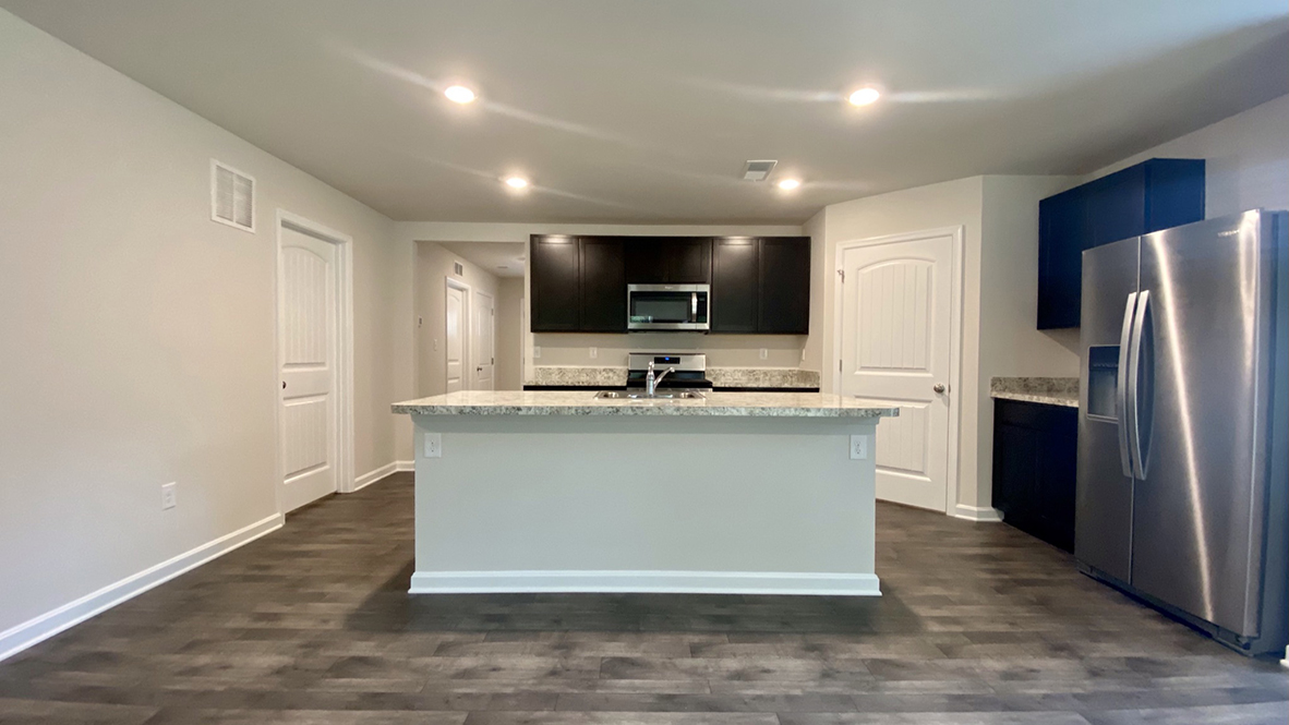 There is a large center island in the kitchen.