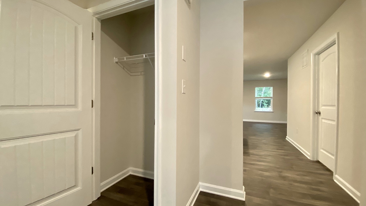 The foyer leads you to a coat closet on one side.