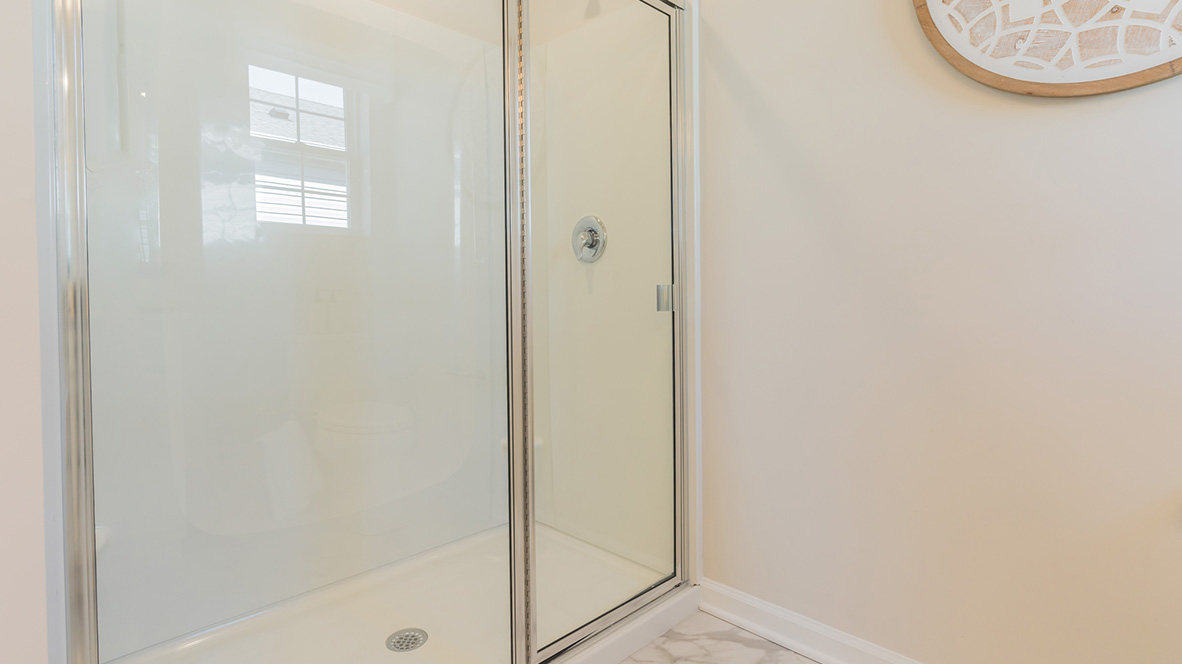There is a private bathroom in the owner's suite with a walk-in shower.