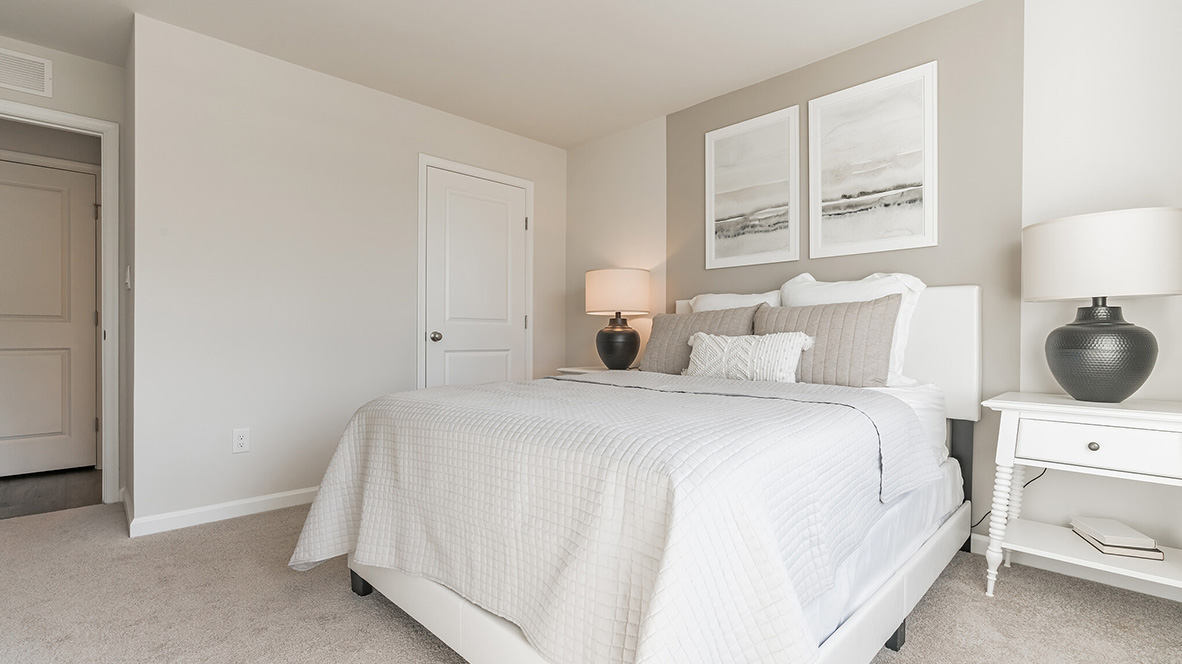 A spacious guest bedroom with a closet is in the front of the home.
