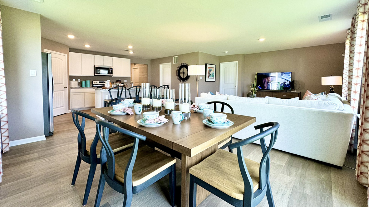 The open-concept kitchen overlooks dining area.