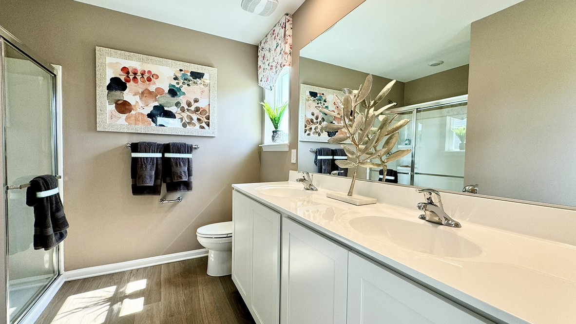The owner's suite includes a private, full bathroom with a walk-in shower.