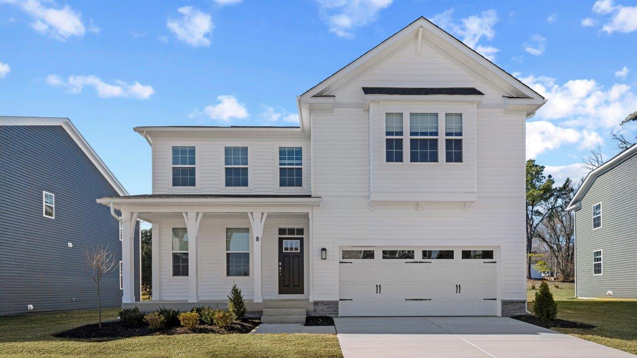 two story home with two car garage
