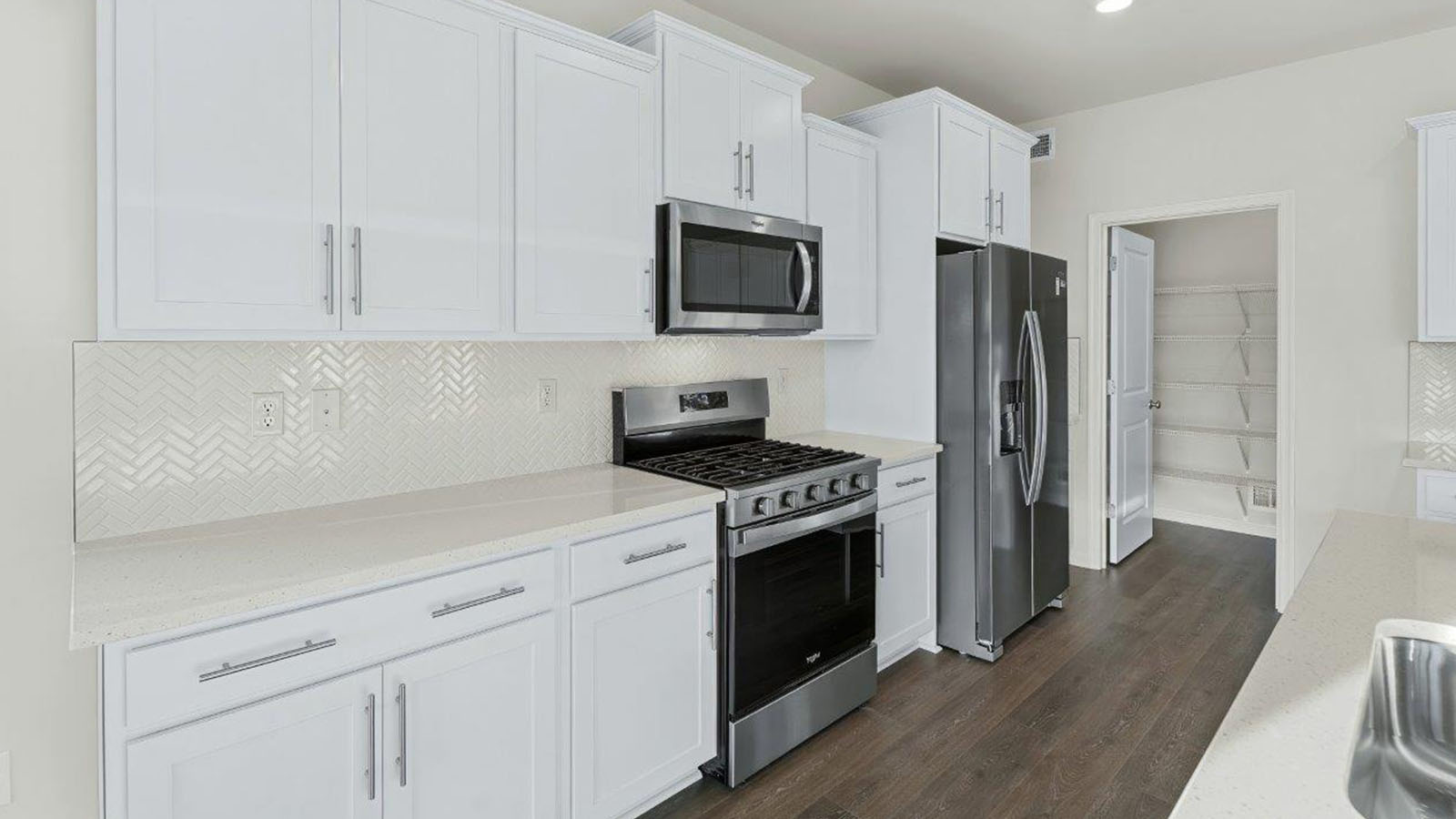 white shaker style cabinets and quartz counters