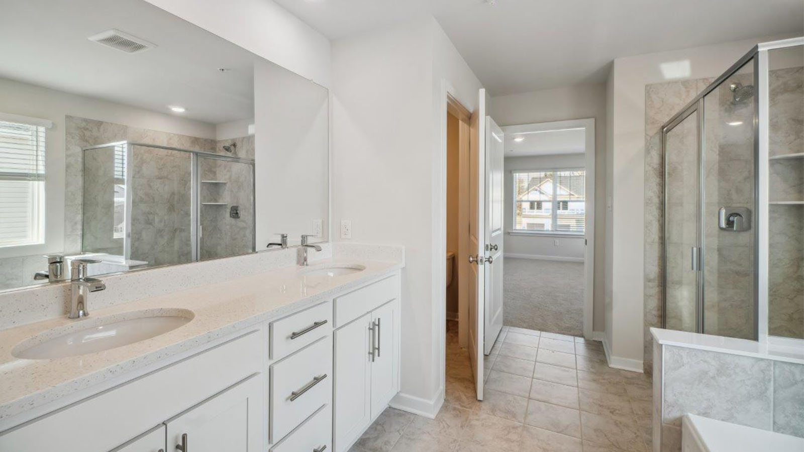 master bathroom two sinks and shower