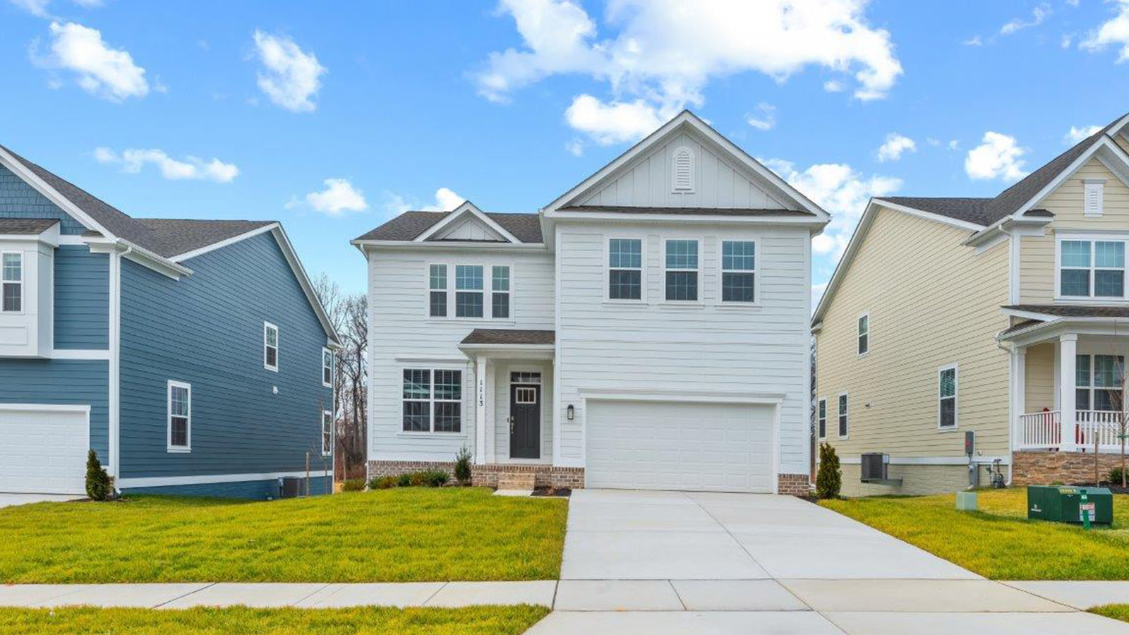 two story home with two car garage
