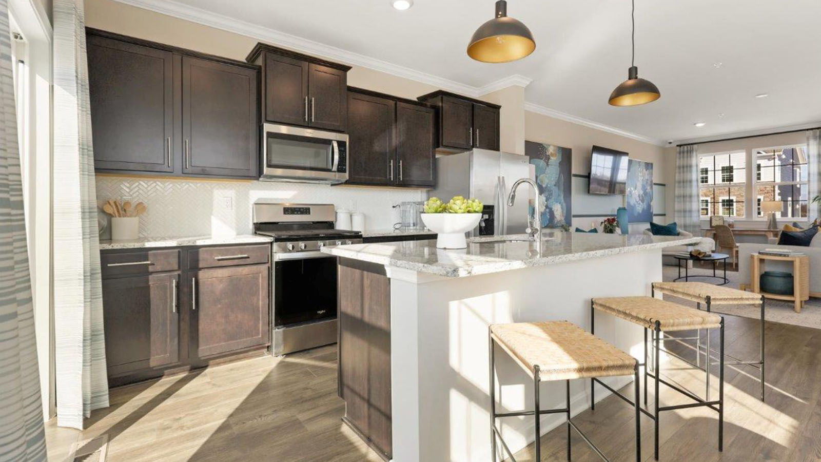 kitchen with dark cabinets and central island seating