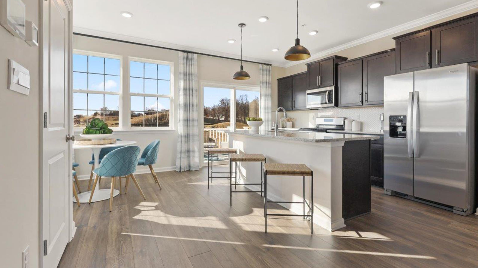 kitchen with dark cabinets and central island seating
