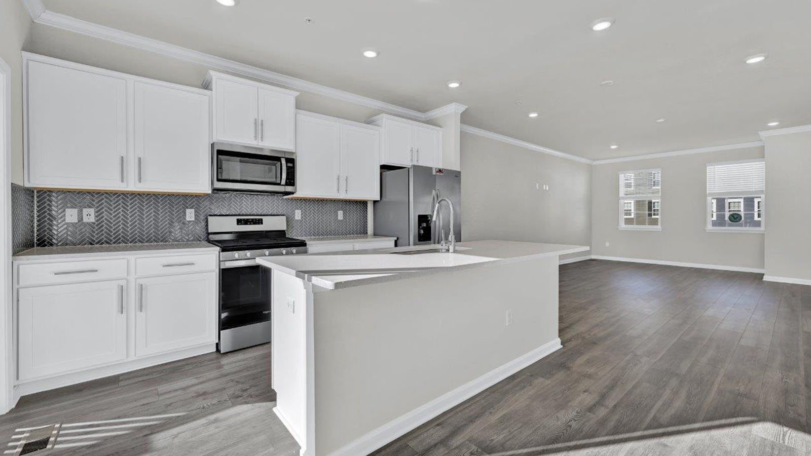 white shaker kitchen cabinets with stainless steel appliances