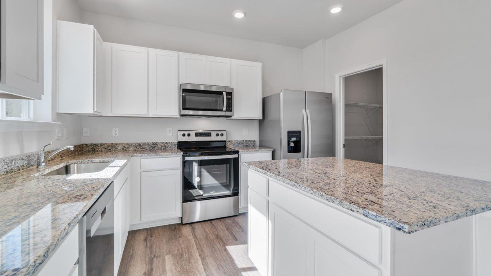 white shaker cabinets and stainless steel appliances