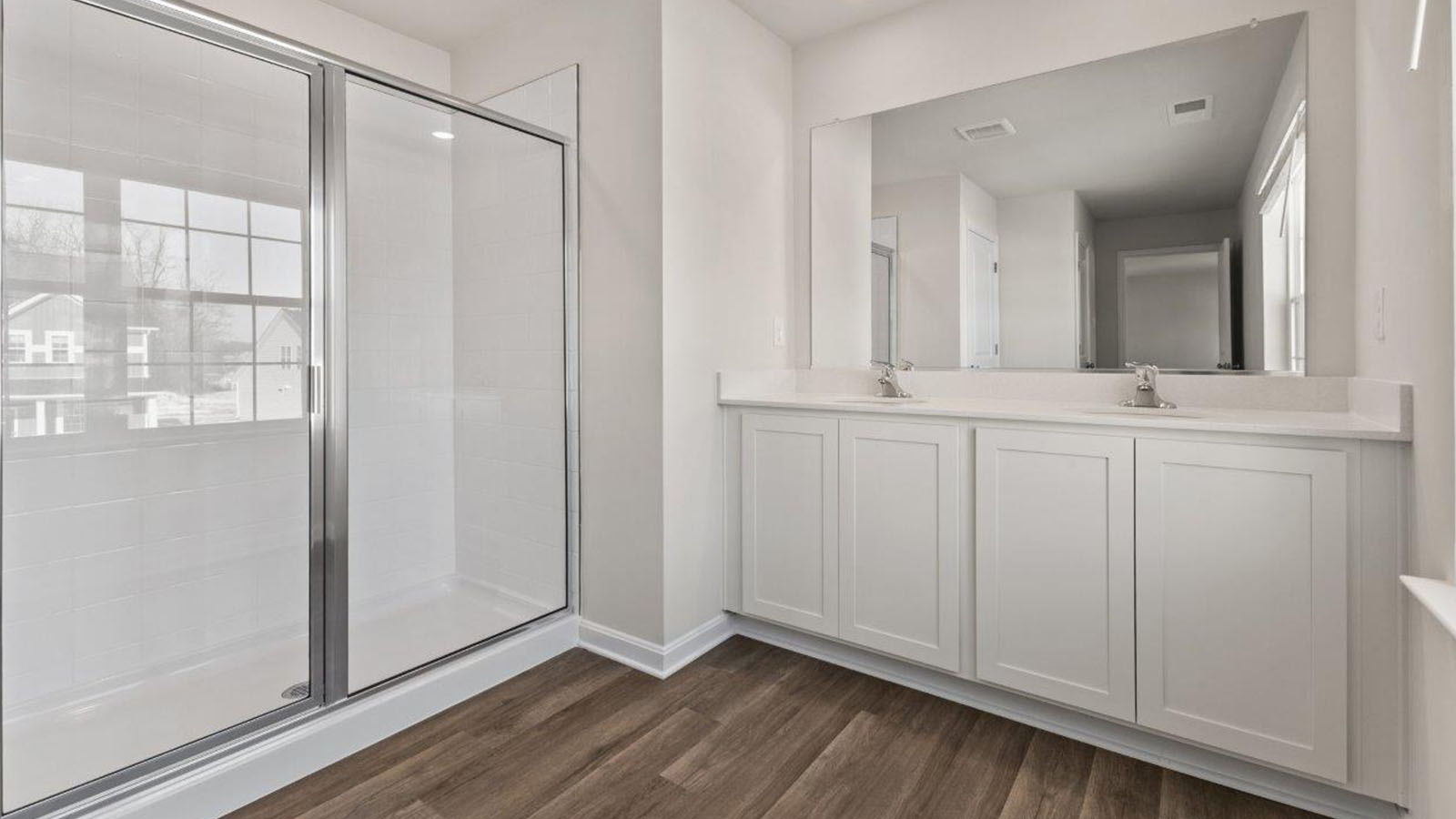 master bathroom dual sinks and shower