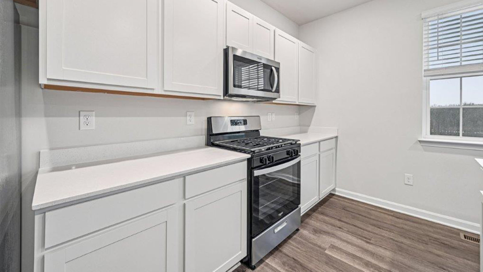 white shaker cabinets and quartz counters