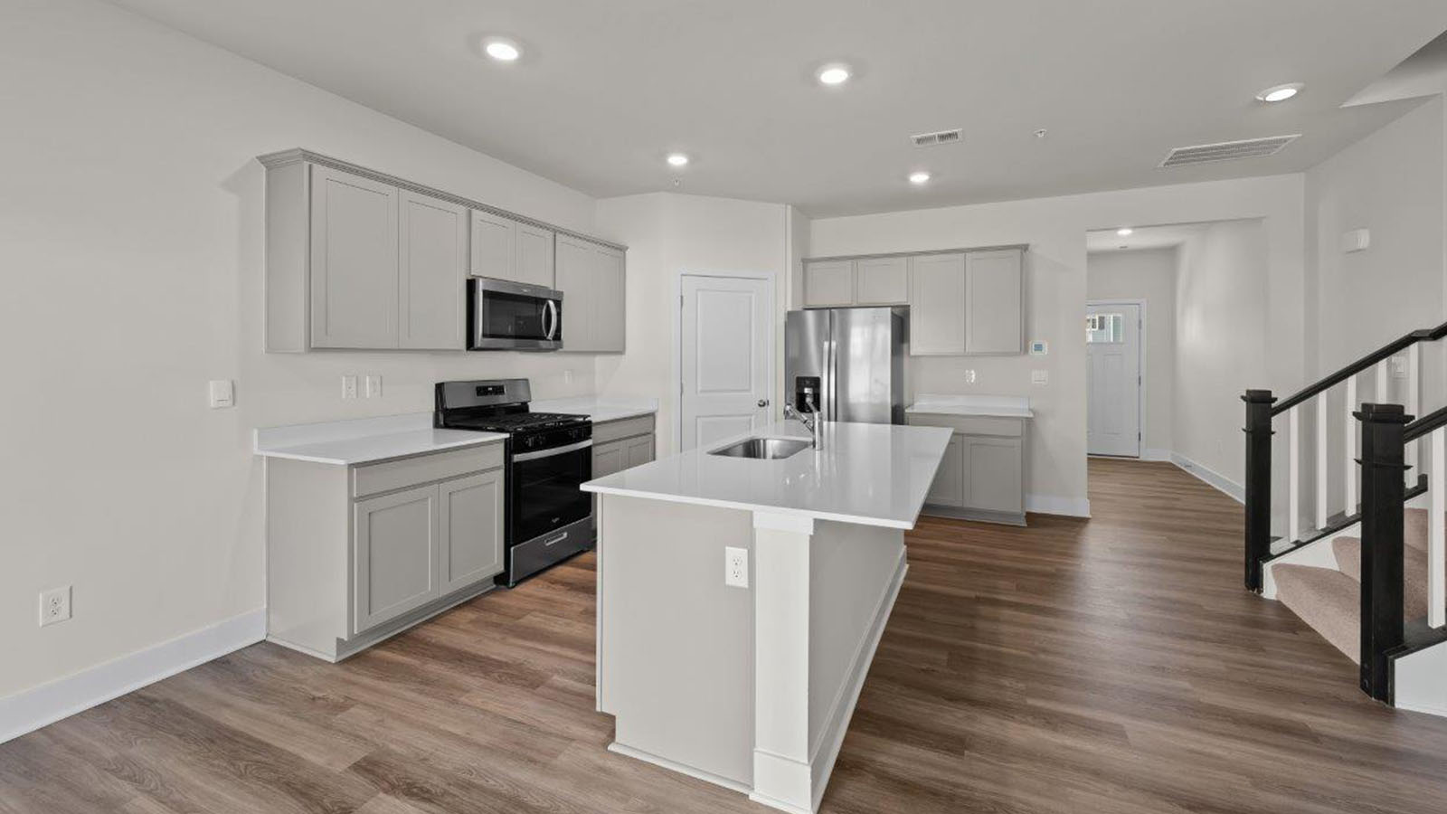 recessed lighting and luxury vinyl plank flooring