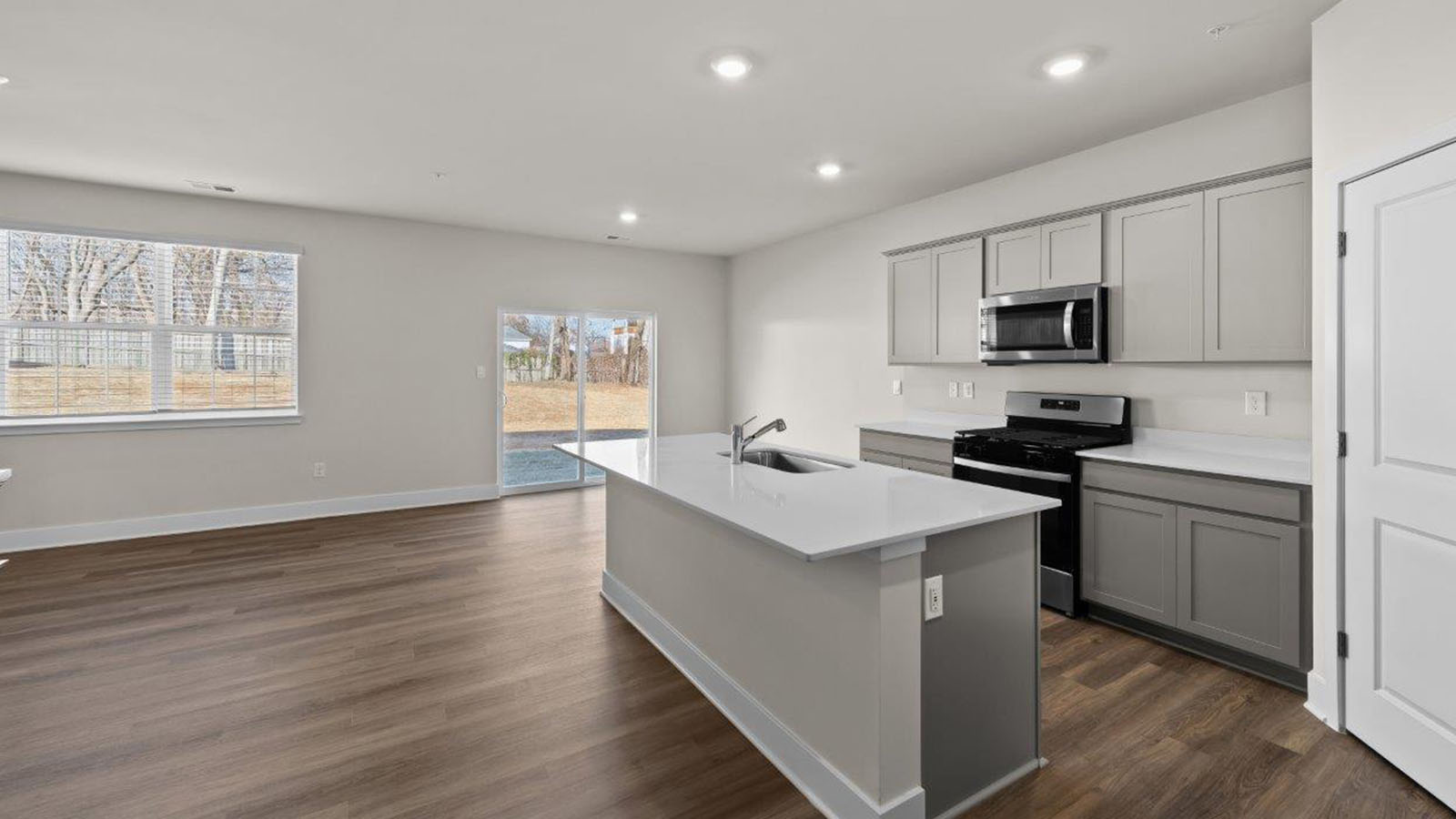 grey shaker style cabinets and stainless steel appliances