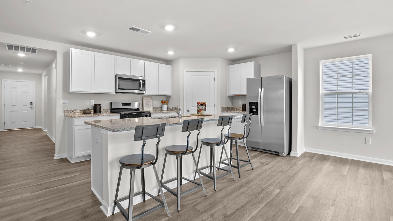 entry leading into open concept kitchen