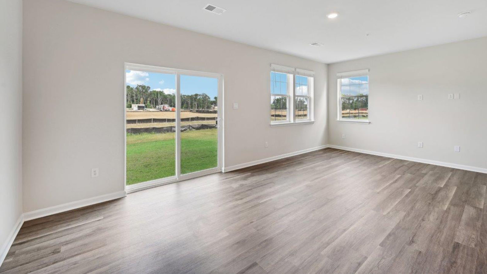open concept living room with back sliding door