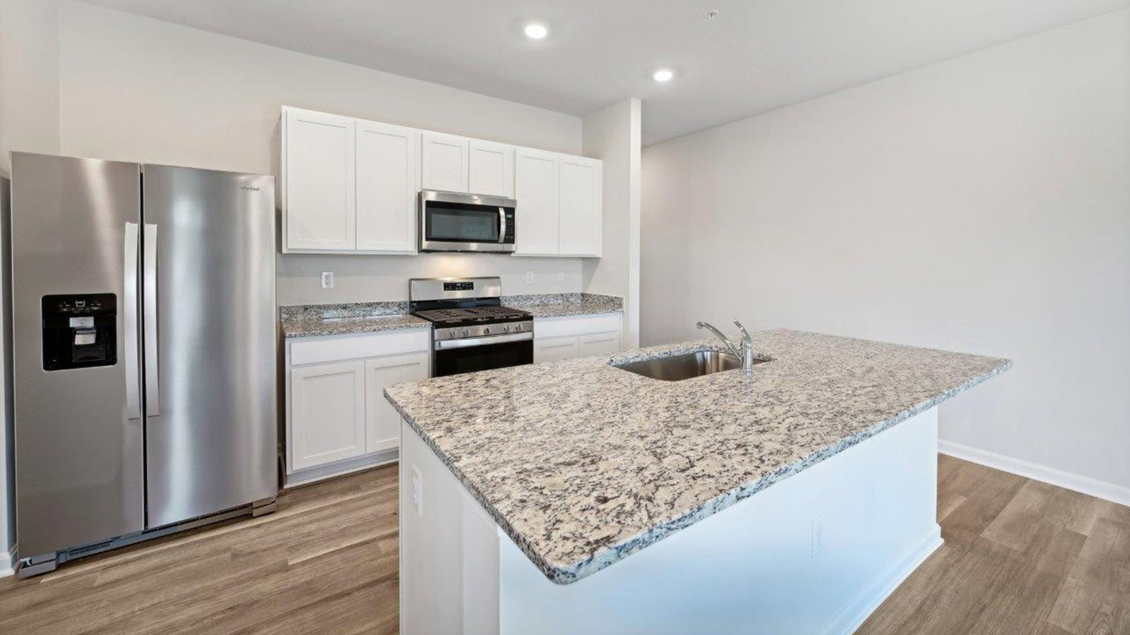 white shaker cabinets and granite counters
