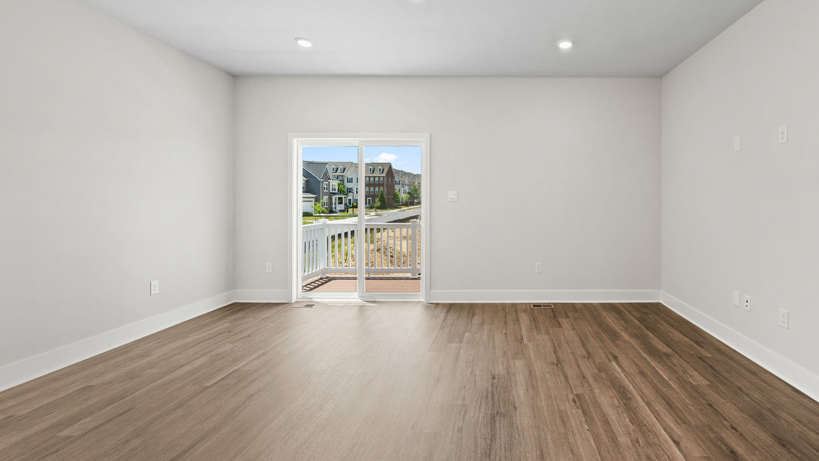 luxury vinyl plank flooring leading to sliding back door