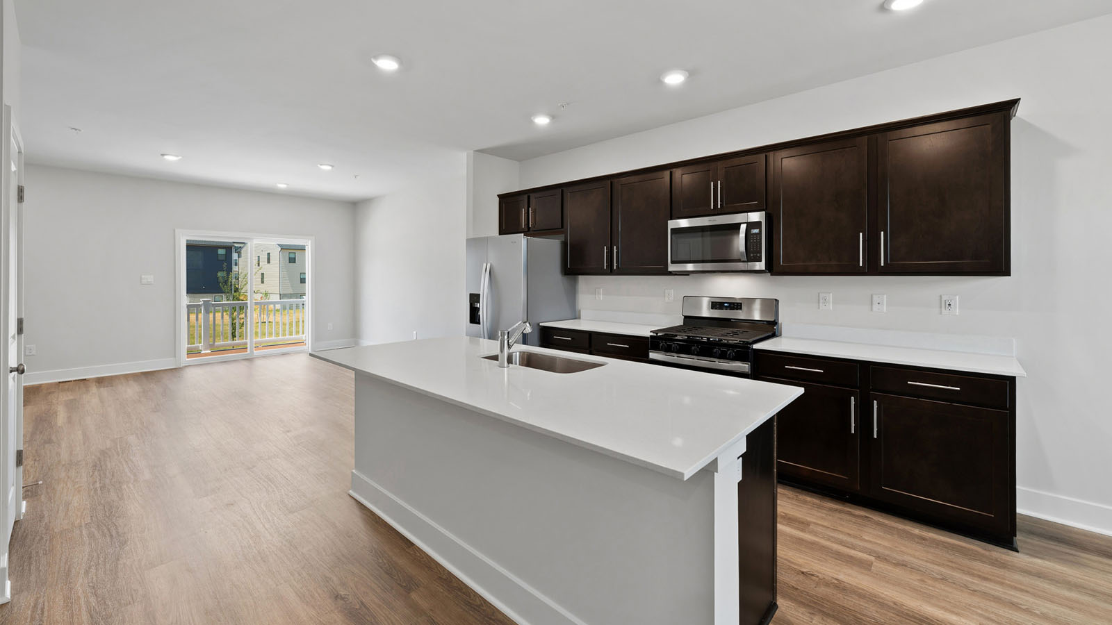 espresso dark cabinets and quartz countertops