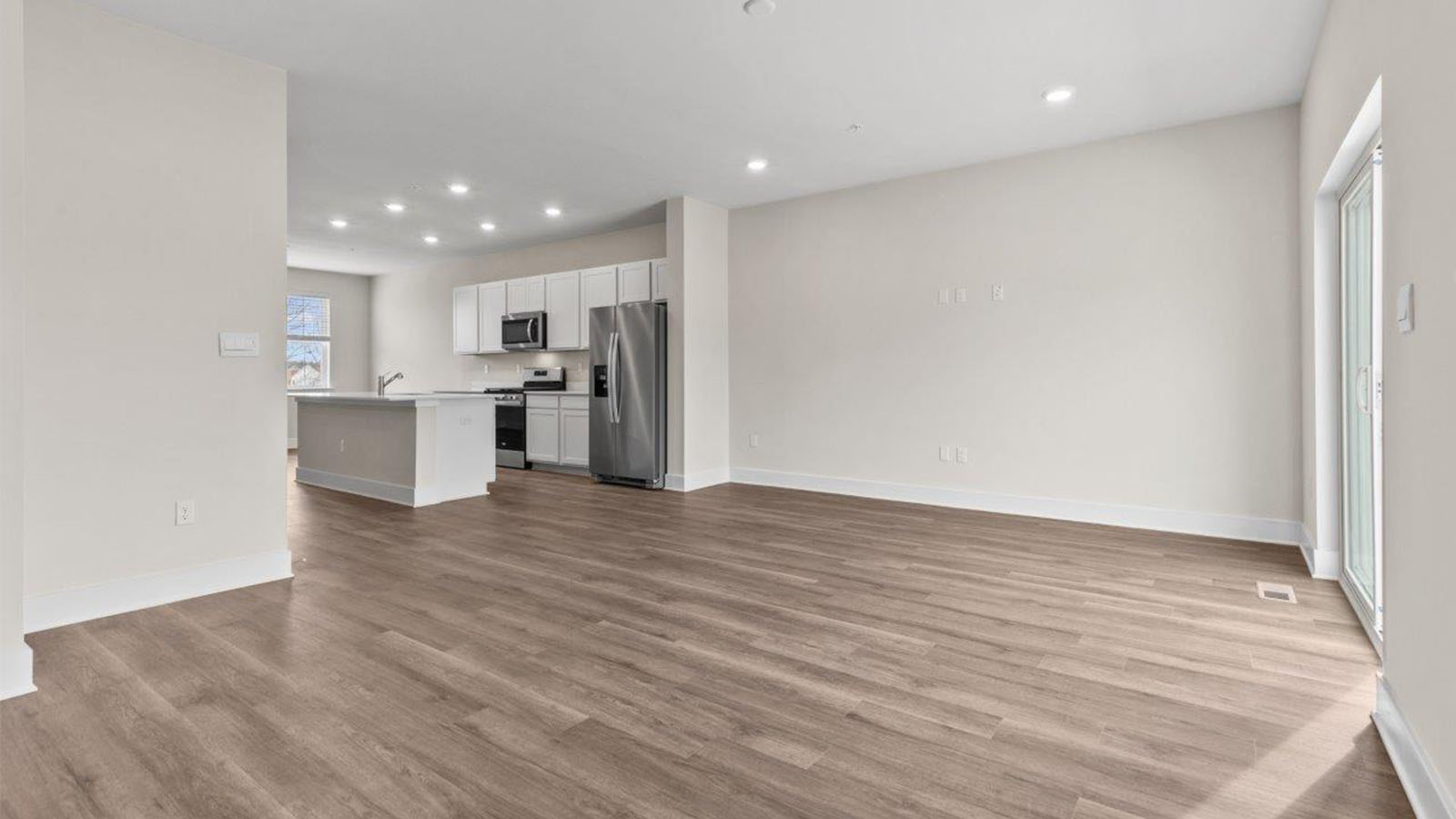 open concept dinign area leading to back door