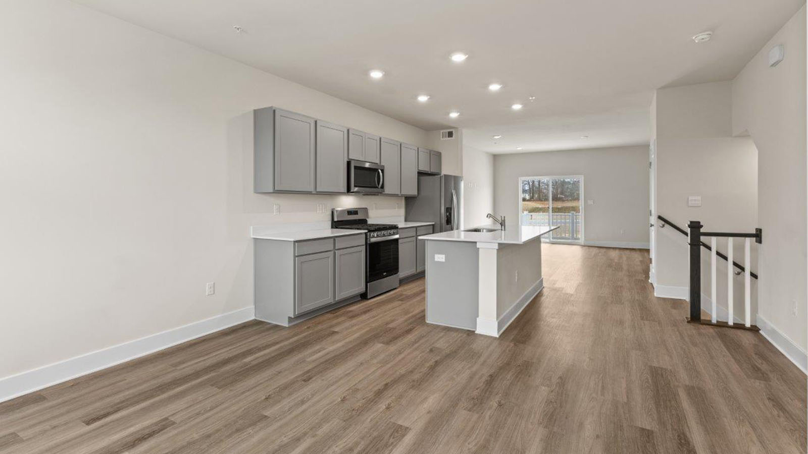 open concept kitchen and living room with central island