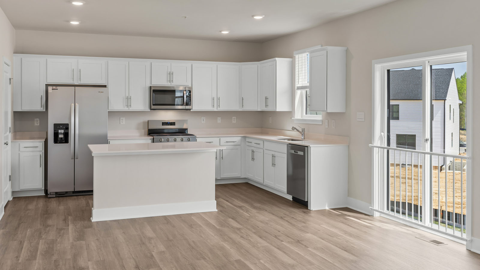 white shaker style kitchen cabinets and quartz counters
