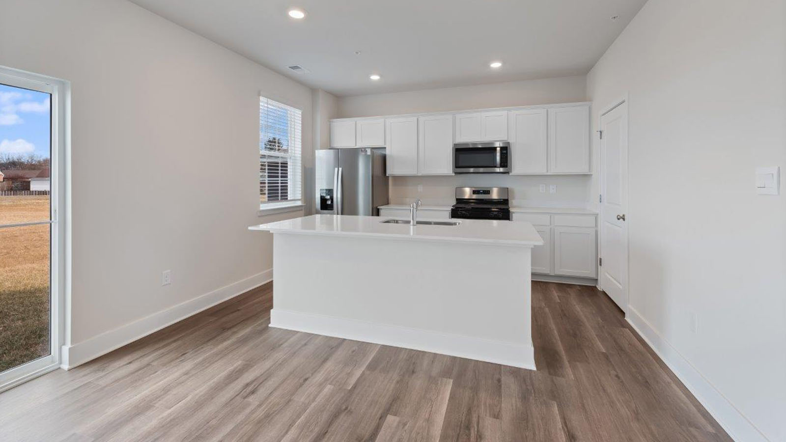 quartz counters and island with seating