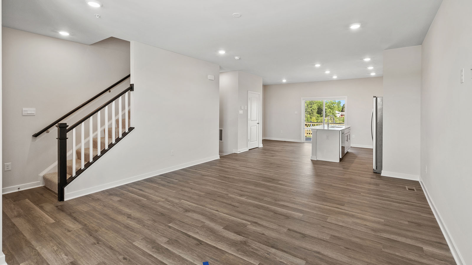 recessed lighting and luxury vinyl plank floors