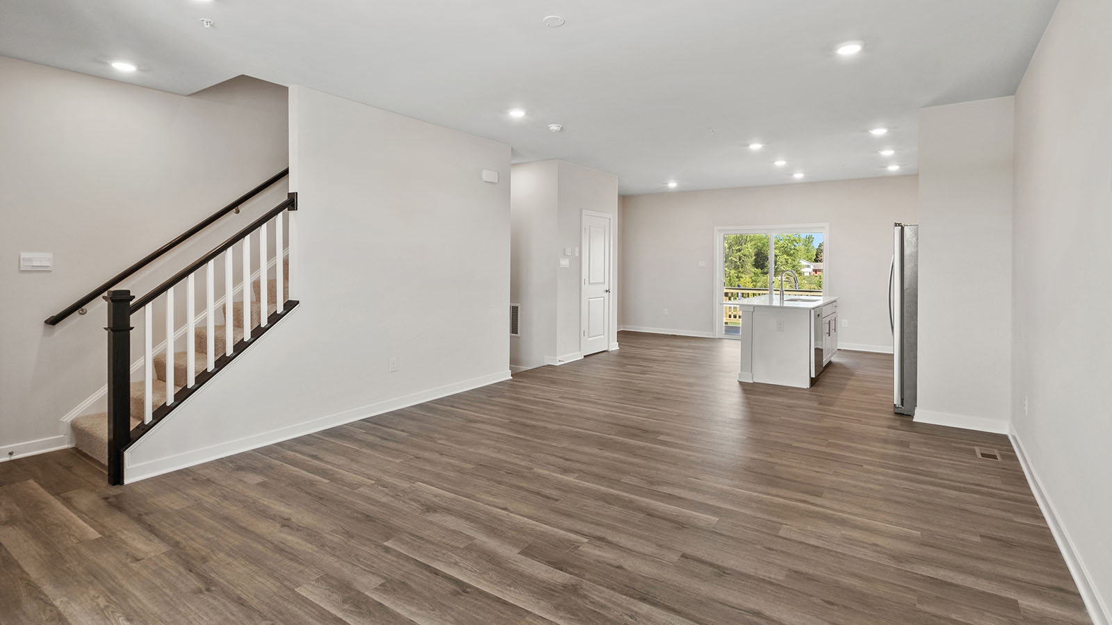 open concept living room with recessed lights