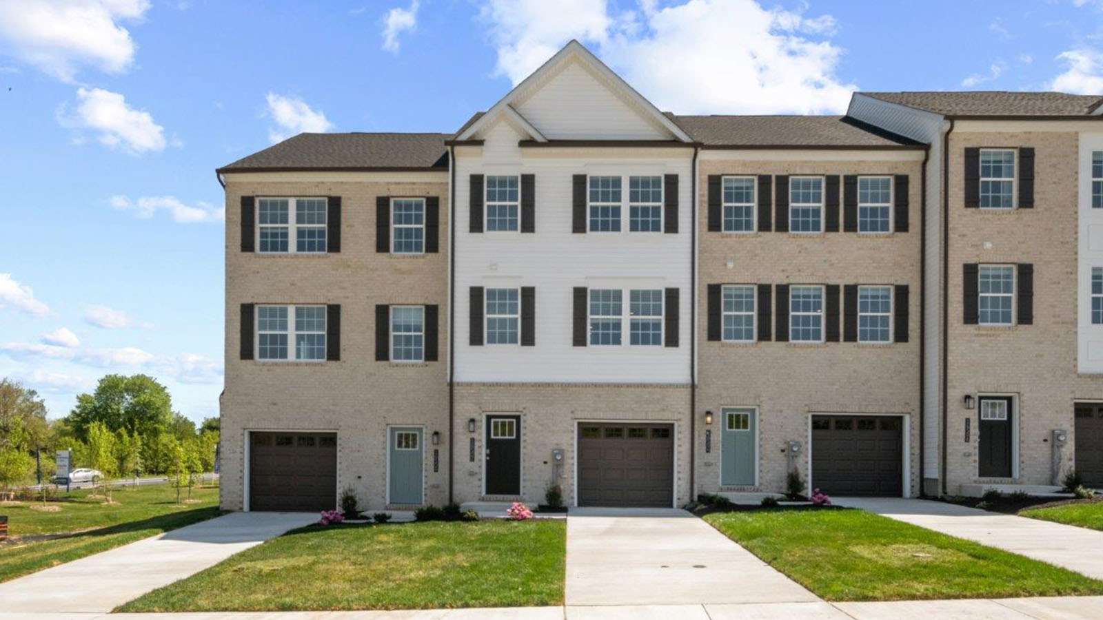 three story townhome with brick
