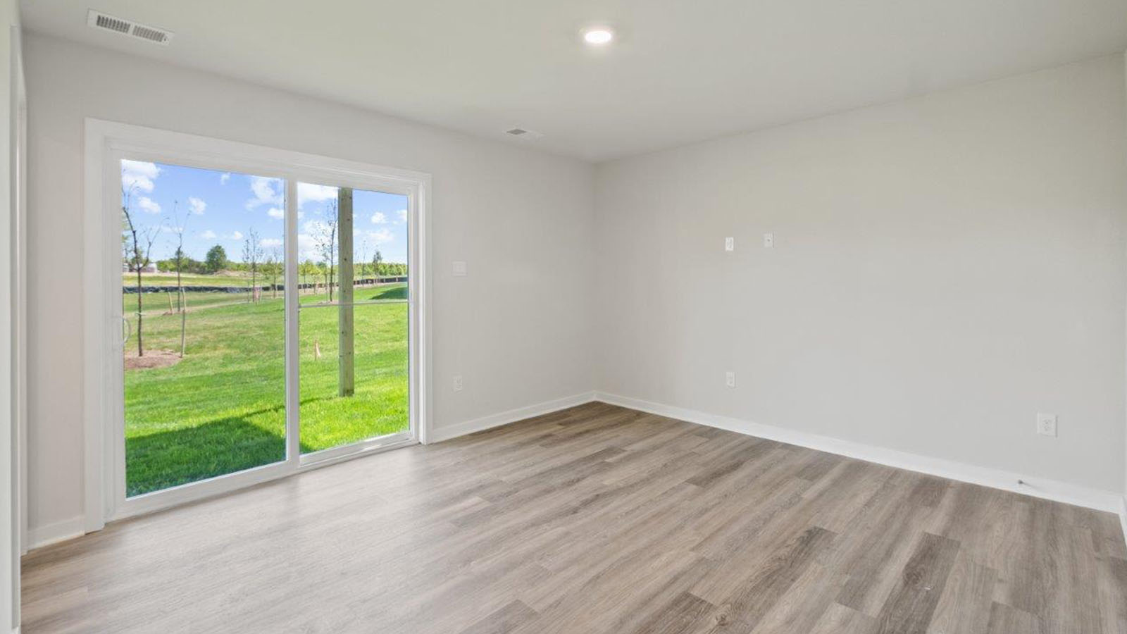 lower level bedroom or den with back door