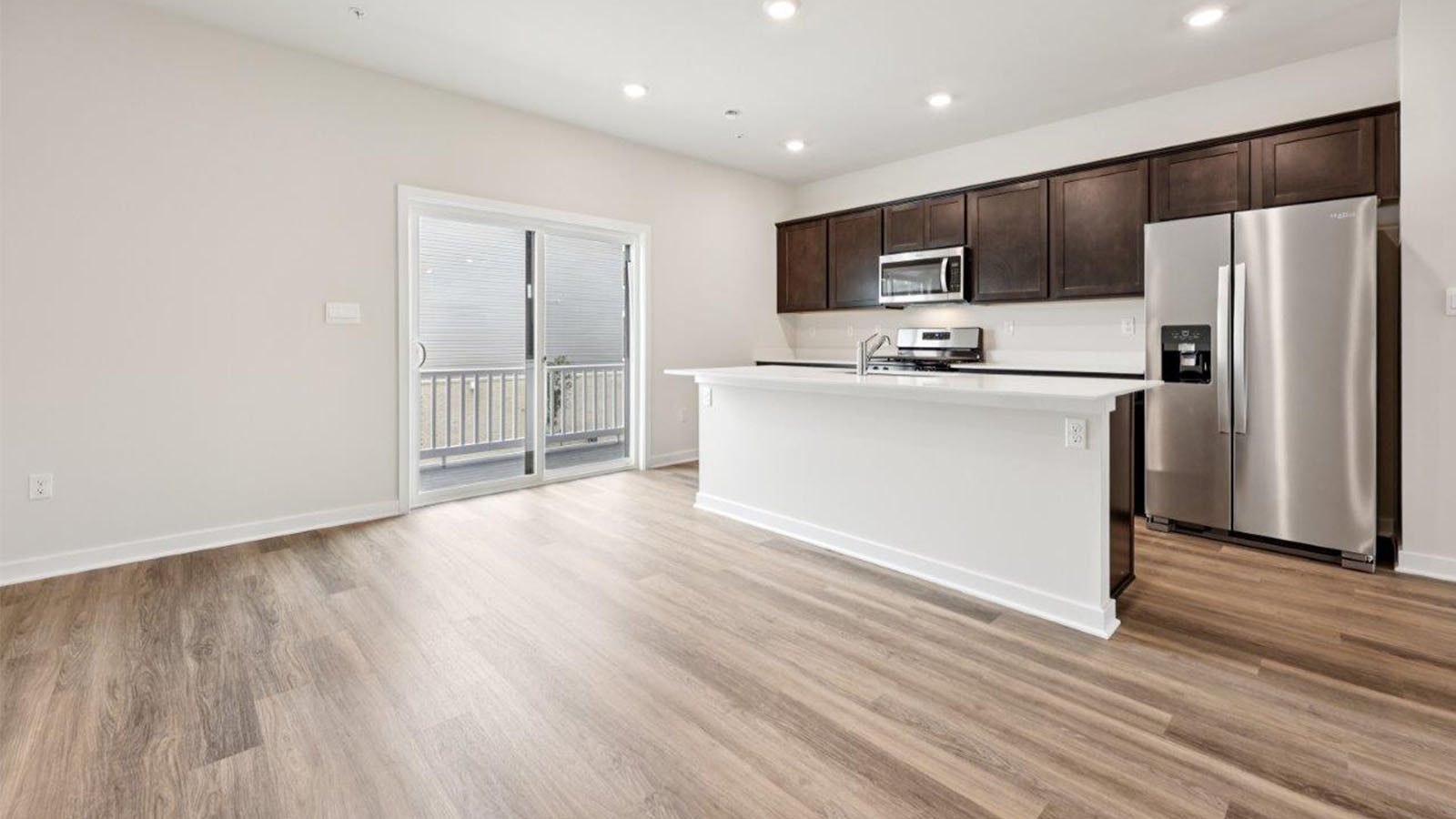 island with seating leading to sliding back door