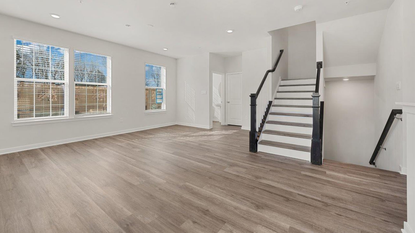living space with hardwood flooring