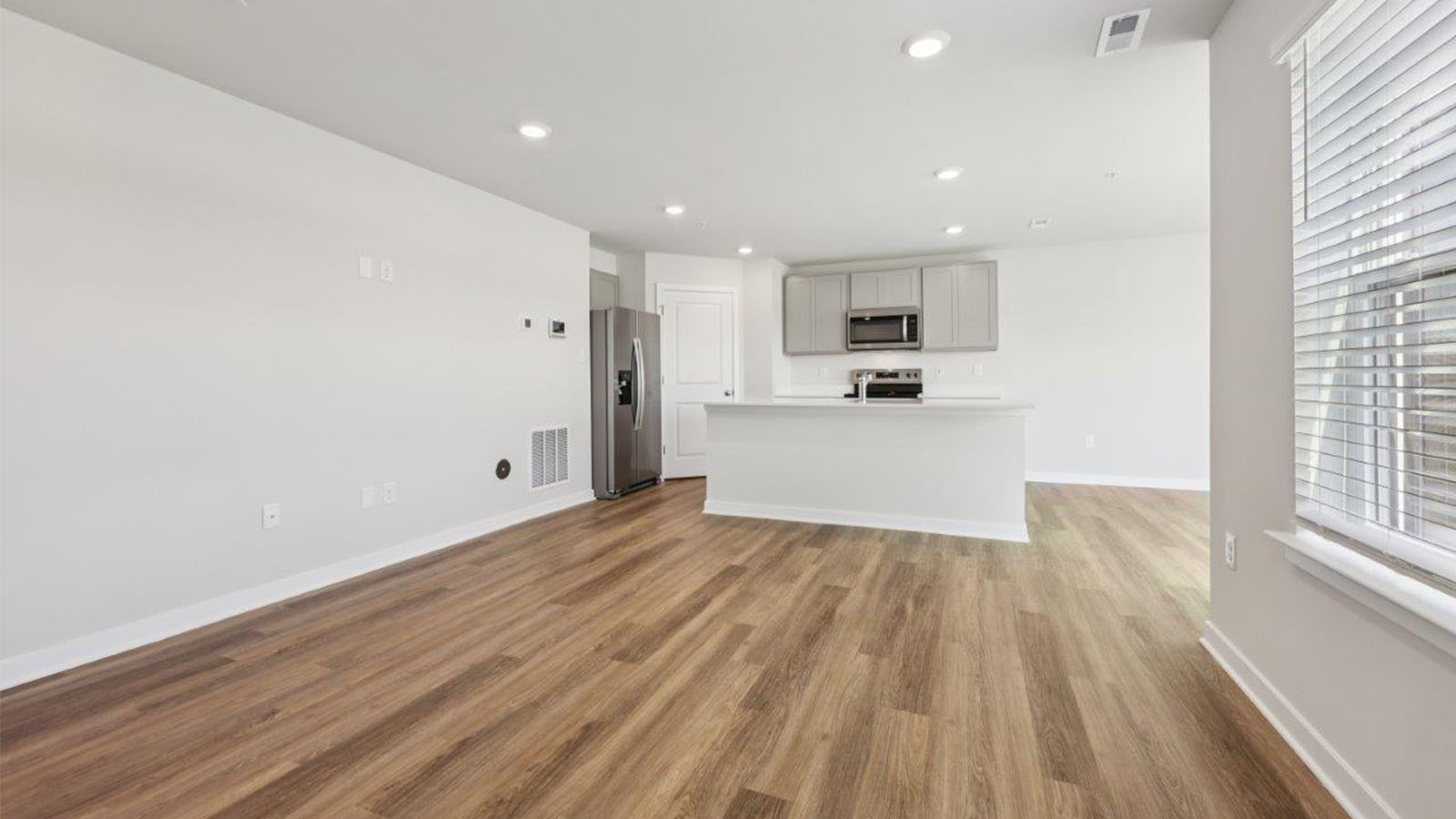 kitchen island with seating overlooking living area