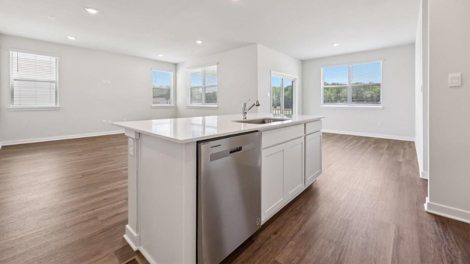 central kitchen island with dishwasher and sink