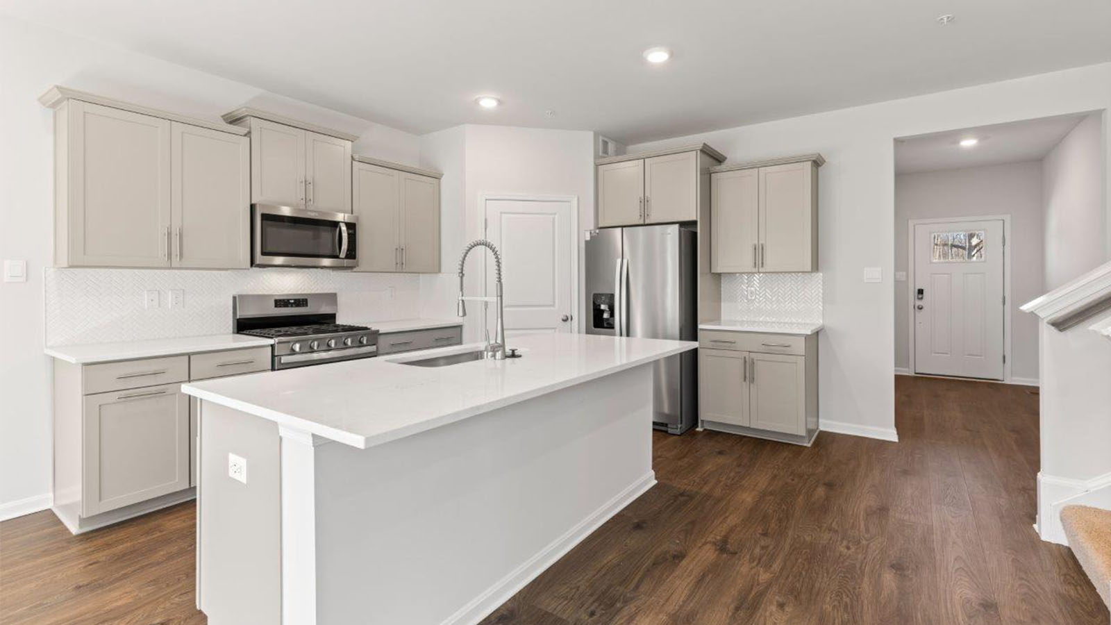 open concept kitchen with grey shaker cabinets