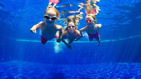 Kids Swimming in Pool